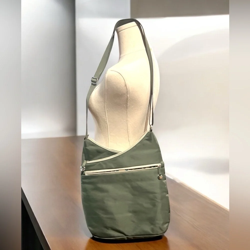 Travelon Anti-theft Crossbody Bag with 7 compartments green.